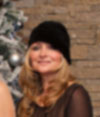 Anna Chocola's Millinery Customer Wearing A Hat 